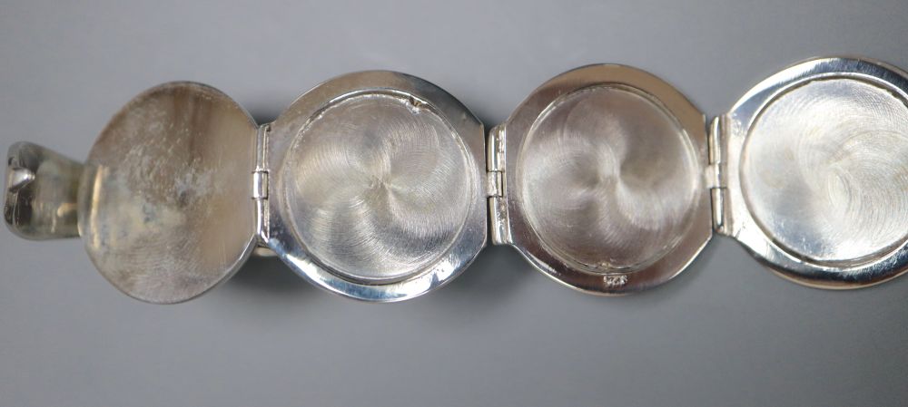 A modern 925 metamorphic hinged sphere pendant, opening to reveal four miniature photograph frames, 27mm.